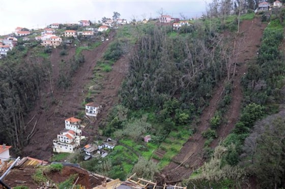 The scars left by landslides are seen Monday on the slopes of Curral das Freiras, a village in the interior of Madeira, Portugal.